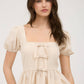 FRONT BOW DETAIL PUFF SLEEVE PEPLUM TOP