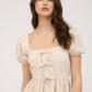FRONT BOW DETAIL PUFF SLEEVE PEPLUM TOP